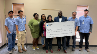  picture of staff accepting large check